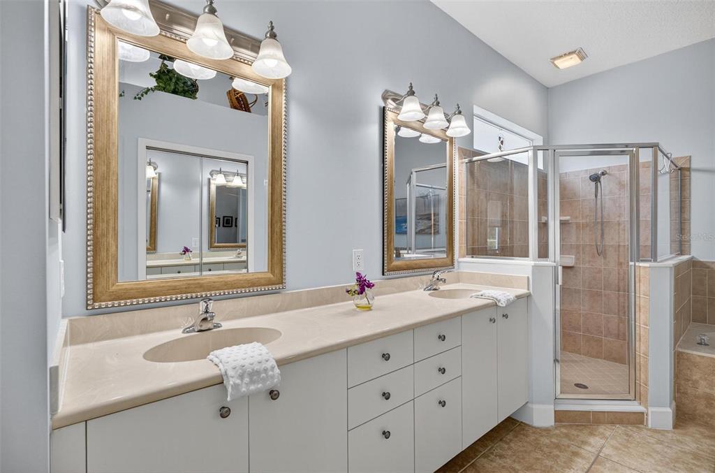 8 Hidden Lake Way Palm Coast, FL 32137 - Photo 26 of 46 a bathroom with a double vanity sink mirror and double