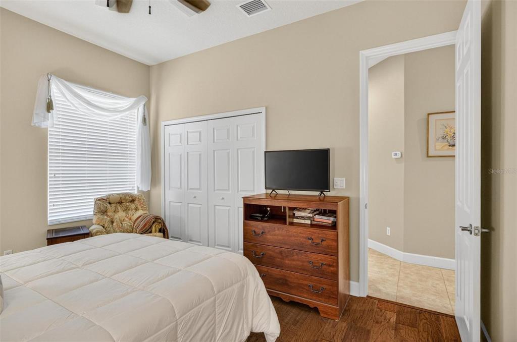 8 Hidden Lake Way Palm Coast, FL 32137 - Photo 36 of 46 a bedroom with a bed and a television