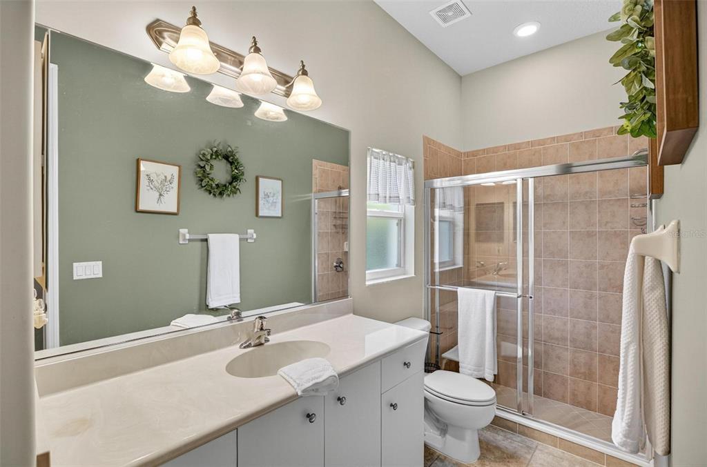 8 Hidden Lake Way Palm Coast, FL 32137 - Photo 38 of 46 a bathroom with a sink vanity mirror and toilet