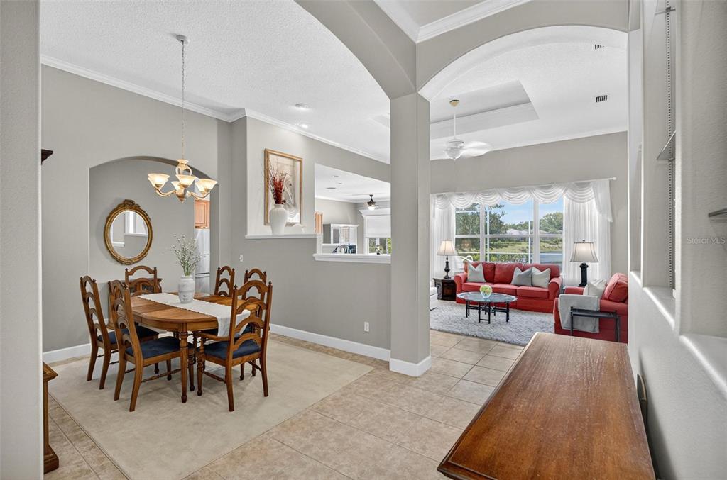 8 Hidden Lake Way Palm Coast, FL 32137 - Photo 5 of 46 a view of a dining room with furniture window and wooden floor