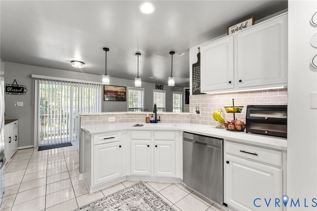 3120 Denise Road Petersburg, VA 23805 - Photo 21 of 51 Kitchen featuring white cabinetry, light-toned cou