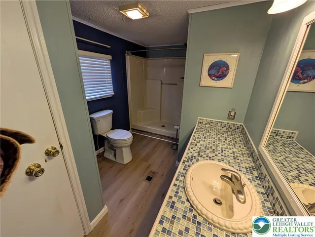 a bathroom with a toilet and a sink