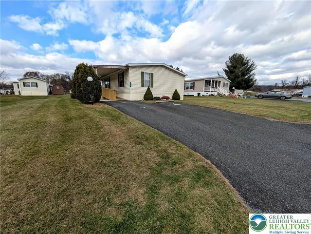 a view of building with car parked