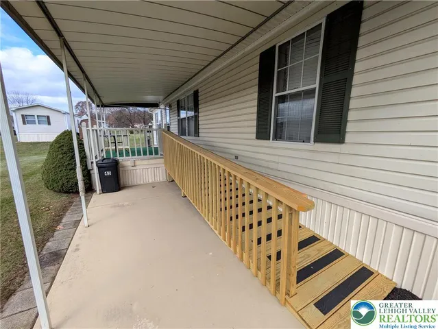a view of a balcony with car parked