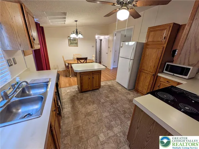 a room with chairs a washer and dryer