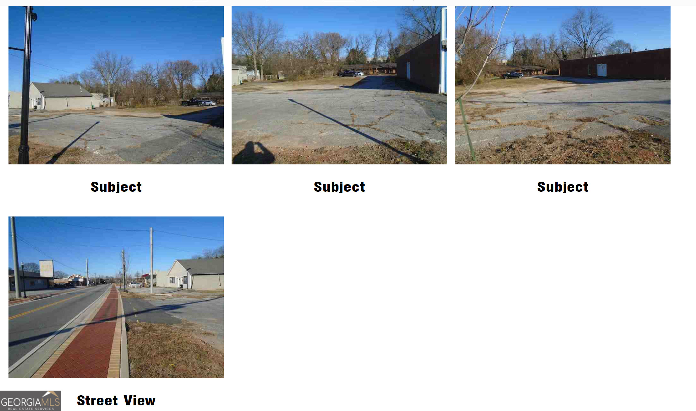 a view of a park with large trees