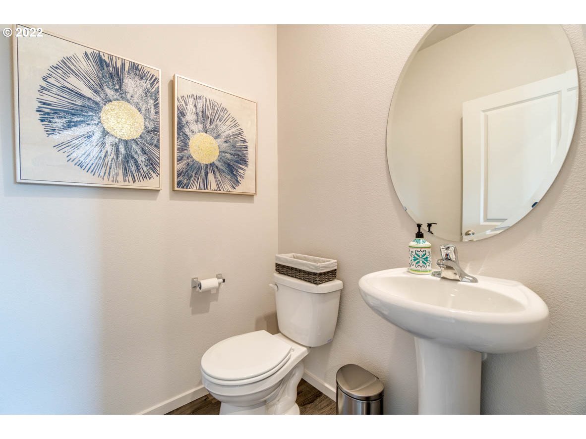 2956 V Street Springfield, OR 97477 - Photo 4 of 22 a bathroom with a toilet a sink and a mirror