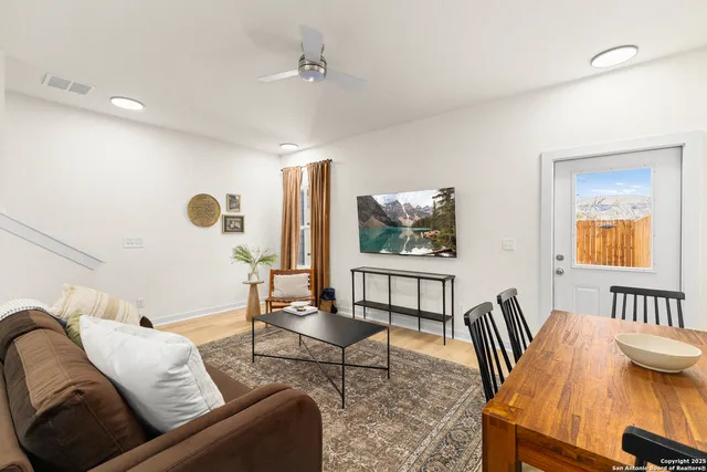 a living room with furniture and a table