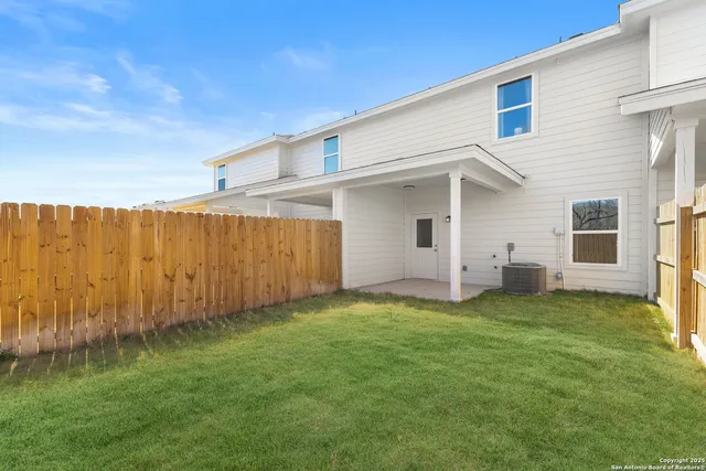 a view of a backyard with plants