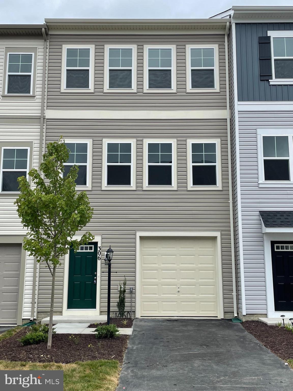 a front view of a house with garage