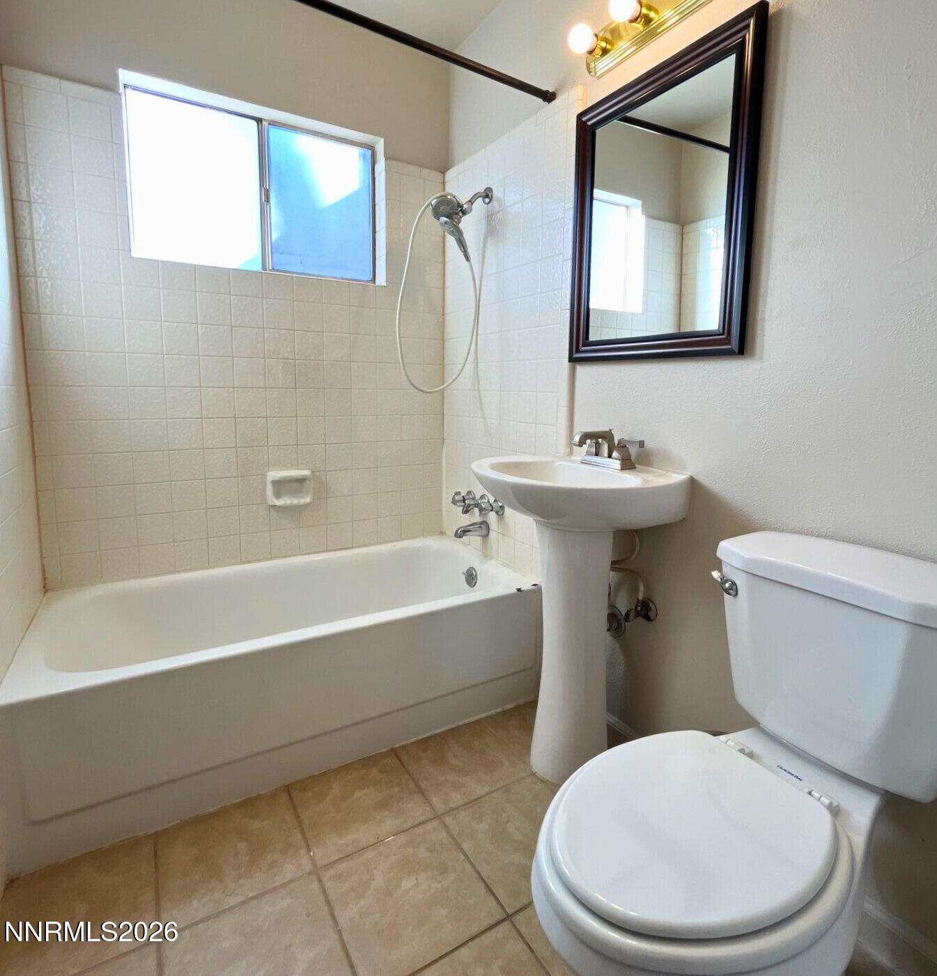 2390 Nelson Way Sparks, NV 89431 - Photo 12 of 16 a bathroom with a toilet a sink and bathtub