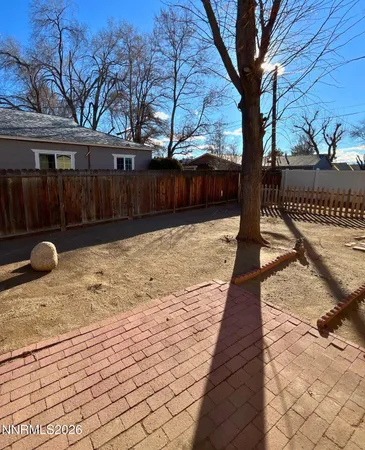 a street view with wooden fence