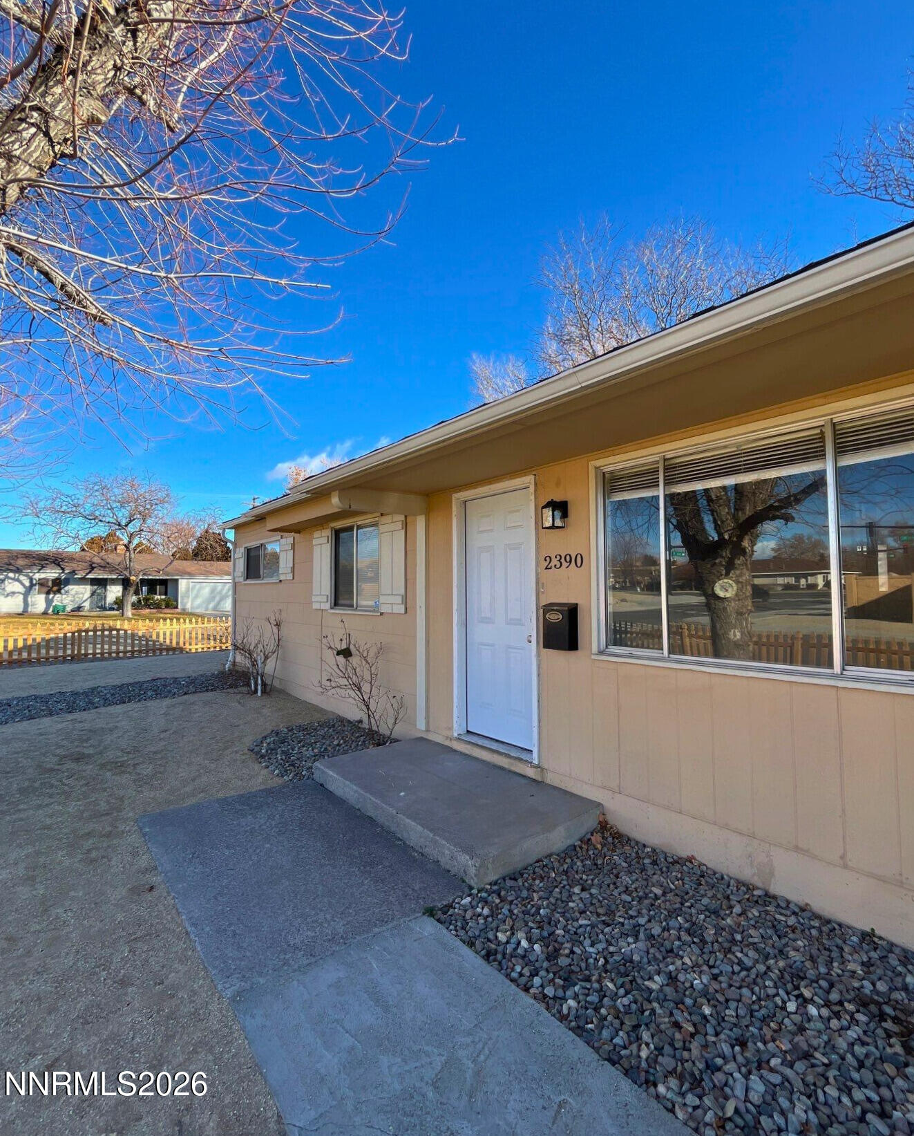 2390 Nelson Way Sparks, NV 89431 - Photo 2 of 16 a front view of a house with a yard