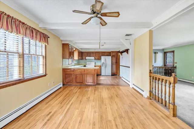 a view of a dining room with furniture window and wooden floor