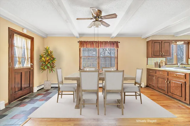 a kitchen with granite countertop stainless steel appliances a refrigerator sink and microwave