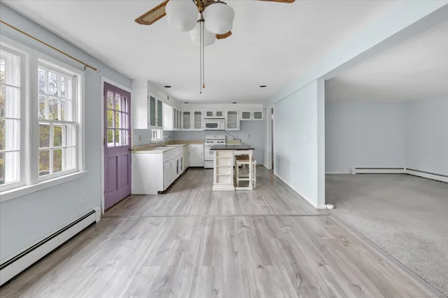 a kitchen with stainless steel appliances a sink stove and refrigerator