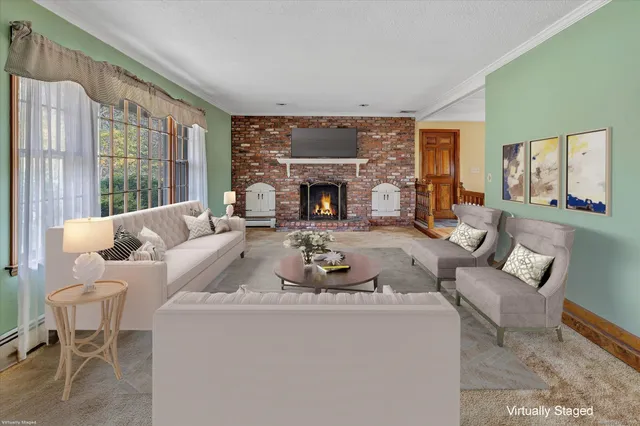 a view of empty room with a fireplace