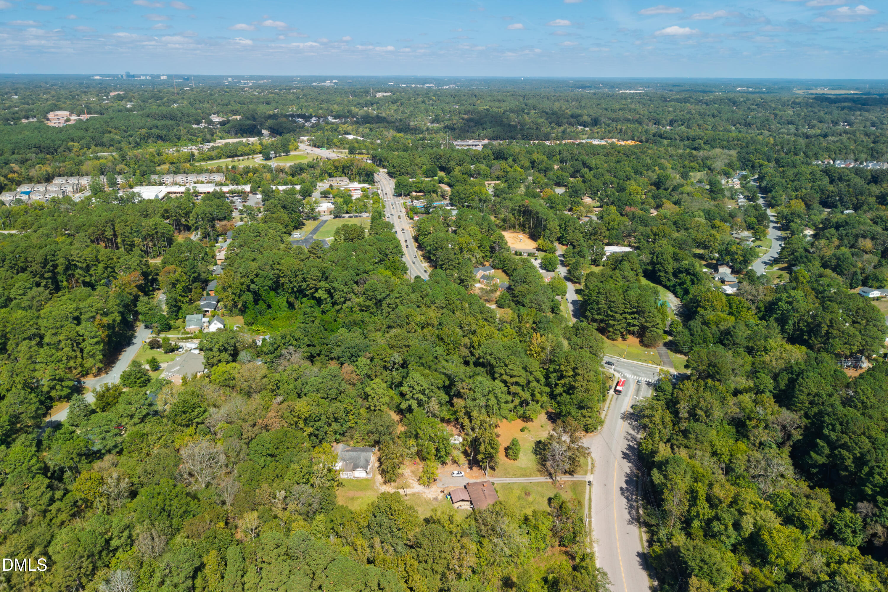 2120 Sanderford Road Raleigh, NC 27610 - Photo 17 of 18 a view of a city with lush green forest