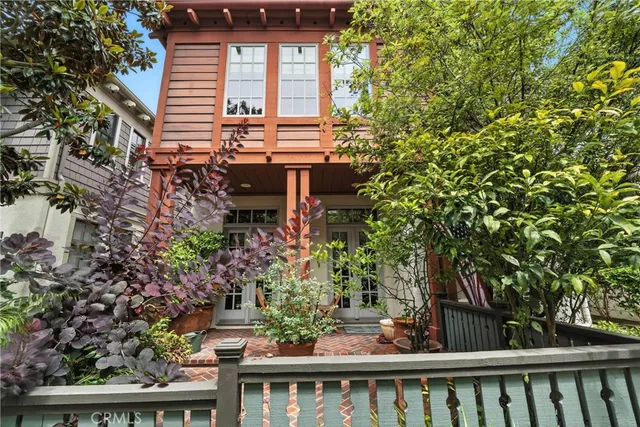 a view of a house with a flower garden