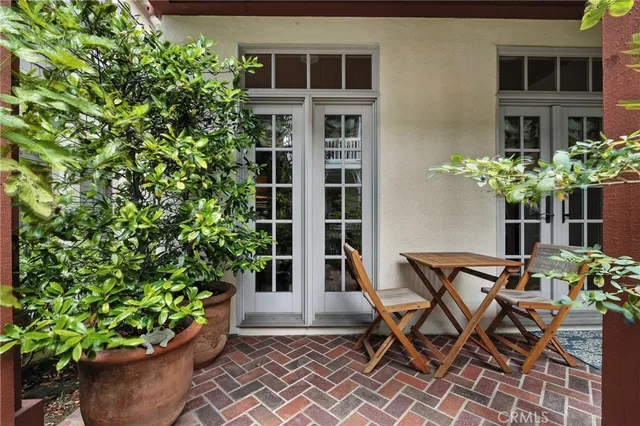 a living room with furniture large window and a fireplace