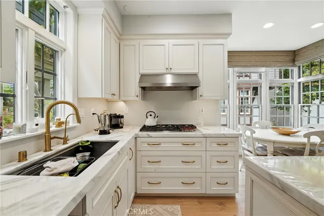 a view of a dining room with furniture and window