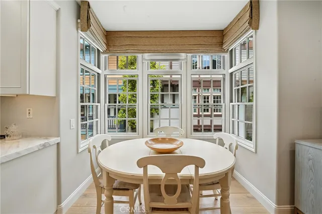 a living room with furniture a flat screen tv and a large window