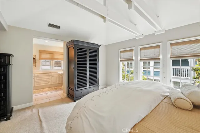 a spacious bathroom with a shower sink and mirror