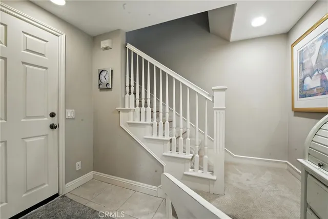 a utility room with cabinets washer and dryer