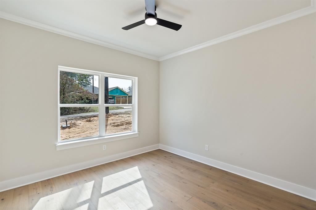 335 Perdanales Bullard, TX 75757 - Photo 7 of 37 a view of an empty room with a window and wooden floor