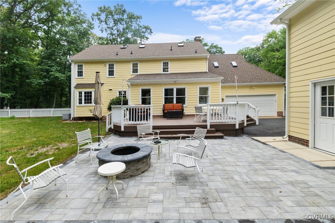 2901 Barrow Place Midlothian, VA 23113 - Photo 37 of 38 a view of a patio with table and chairs potted plants and a large tree
