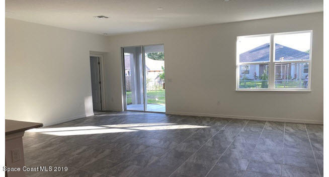 918 Raleigh Road Southeast Palm Bay, FL 32909 - Photo 5 of 13 Living/Dining Combo