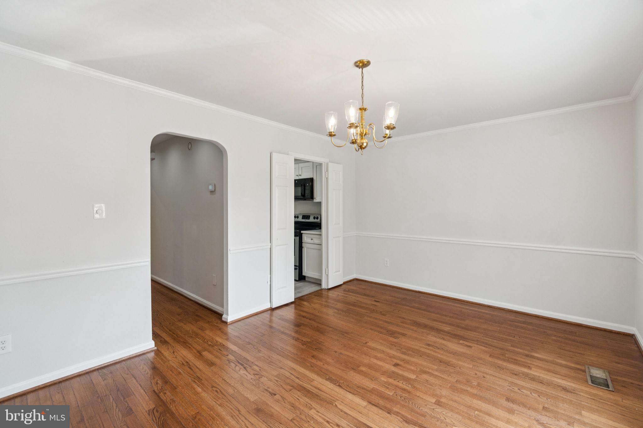 6711 Washington Boulevard, Unit C Arlington, VA 22205 - Photo 12 of 30 a view of empty room with wooden floor