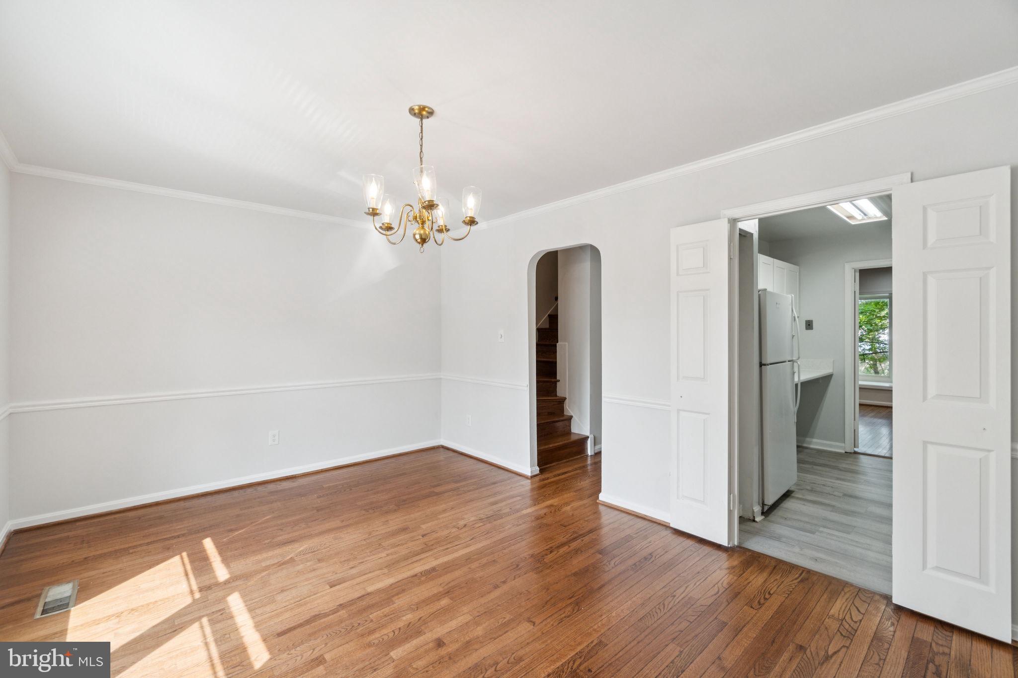 6711 Washington Boulevard, Unit C Arlington, VA 22205 - Photo 13 of 30 a view of a room with wooden floor