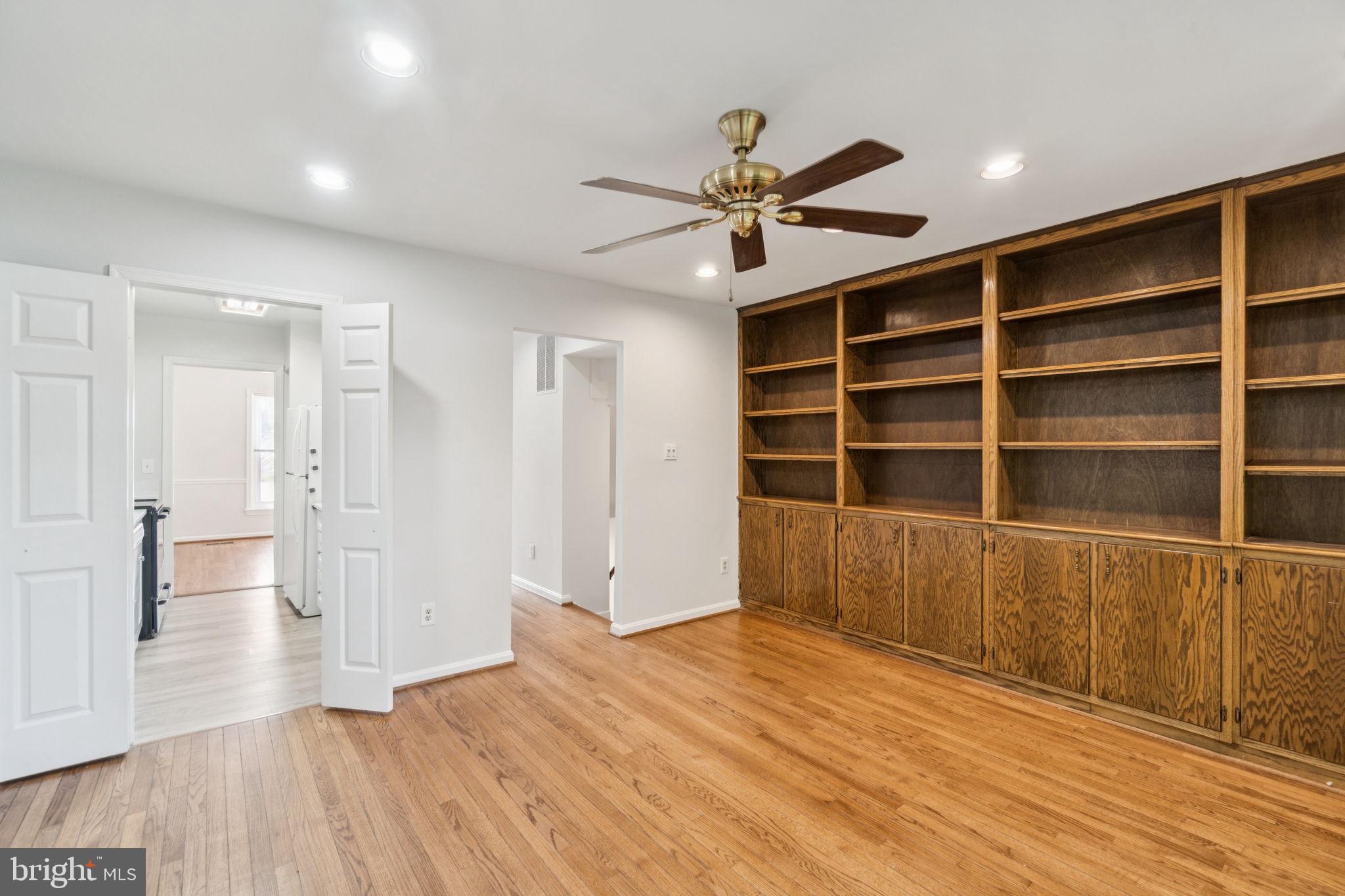 6711 Washington Boulevard, Unit C Arlington, VA 22205 - Photo 17 of 30 a view of empty room with wooden floor and cabinet
