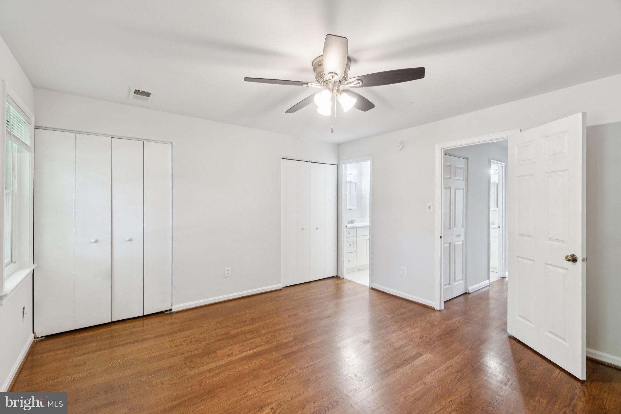 6711 Washington Boulevard, Unit C Arlington, VA 22205 - Photo 21 of 30 a view of an empty room with wooden floor