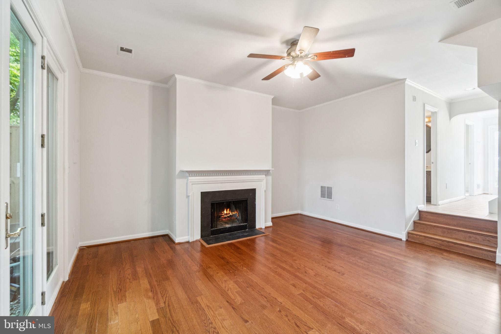 6711 Washington Boulevard, Unit C Arlington, VA 22205 - Photo 6 of 30 a view of empty room with wooden floor and fan