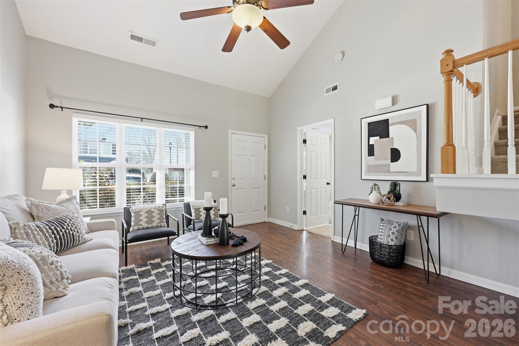212 Primrose Walk Fort Mill, SC 29715 - Photo 11 of 37 a living room with furniture and wooden floor
