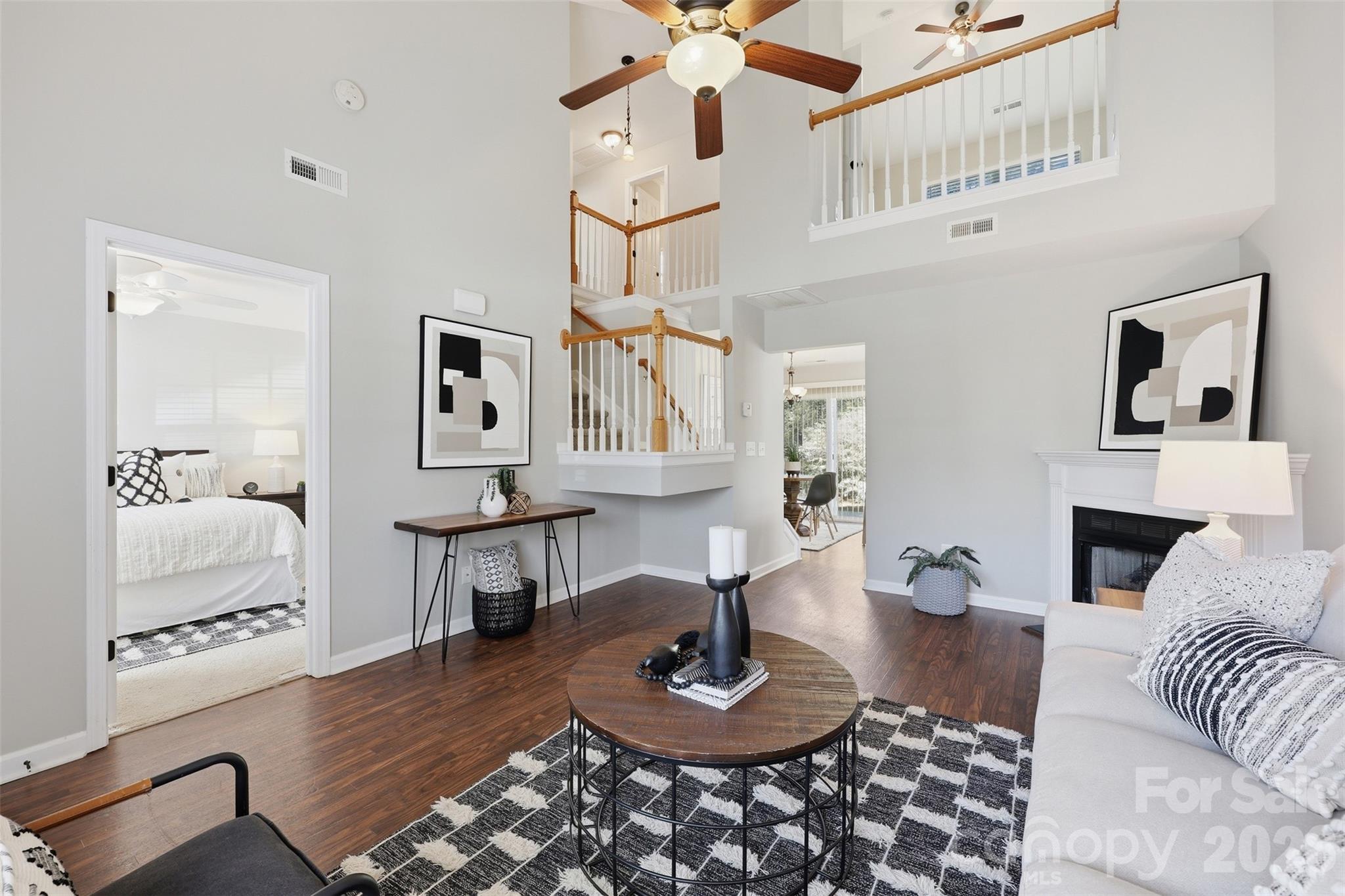 212 Primrose Walk Fort Mill, SC 29715 - Photo 12 of 37 a living room with furniture and wooden floor