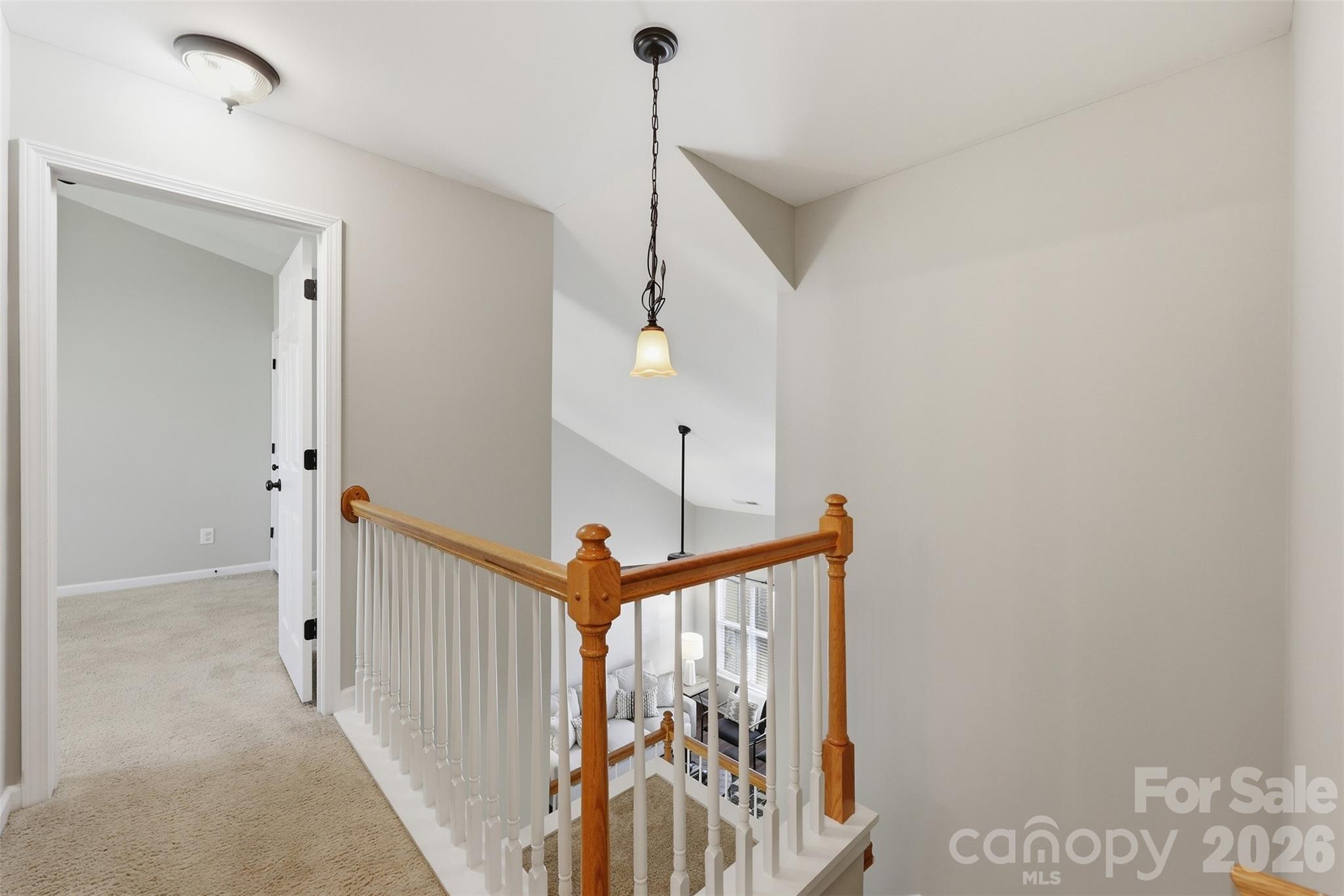 212 Primrose Walk Fort Mill, SC 29715 - Photo 13 of 37 a view of a hallway with a chandelier