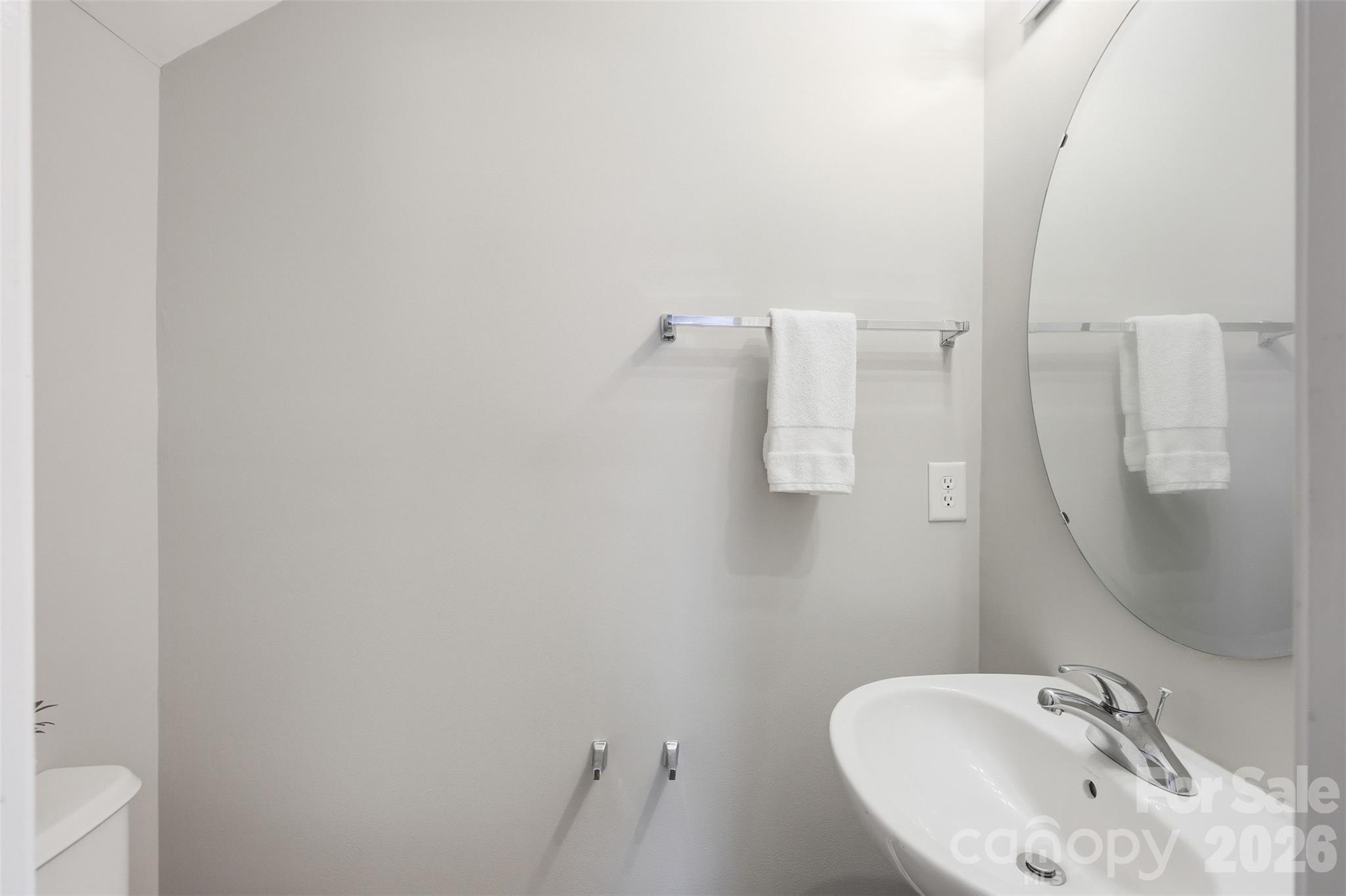 212 Primrose Walk Fort Mill, SC 29715 - Photo 18 of 37 a bathroom with a sink and mirror with toilet