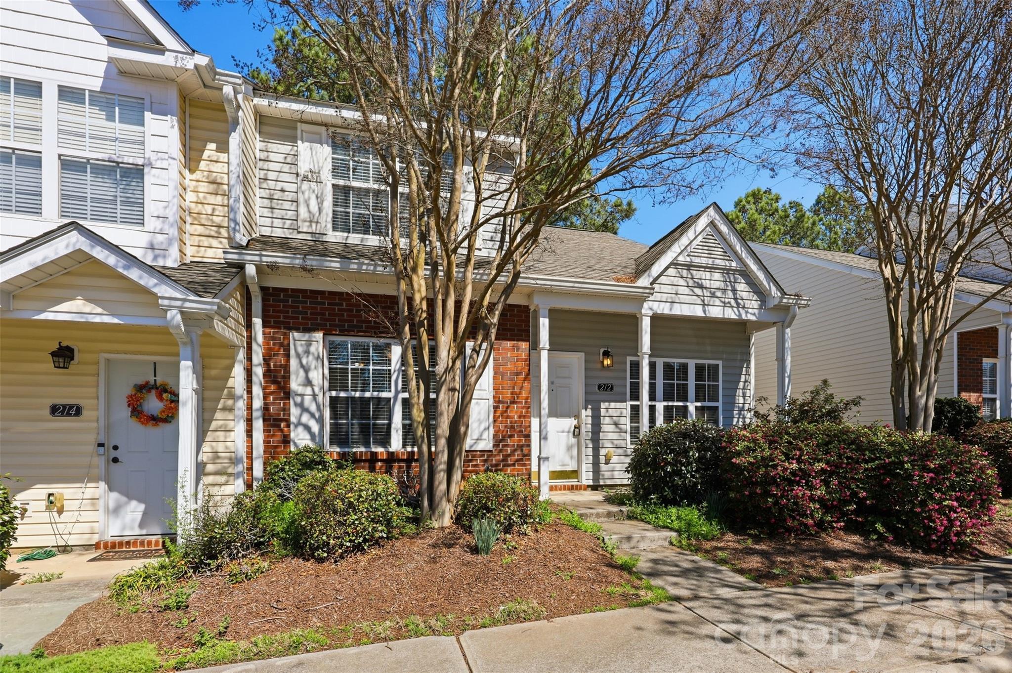 212 Primrose Walk Fort Mill, SC 29715 - Photo 2 of 37 a front view of a house with garden