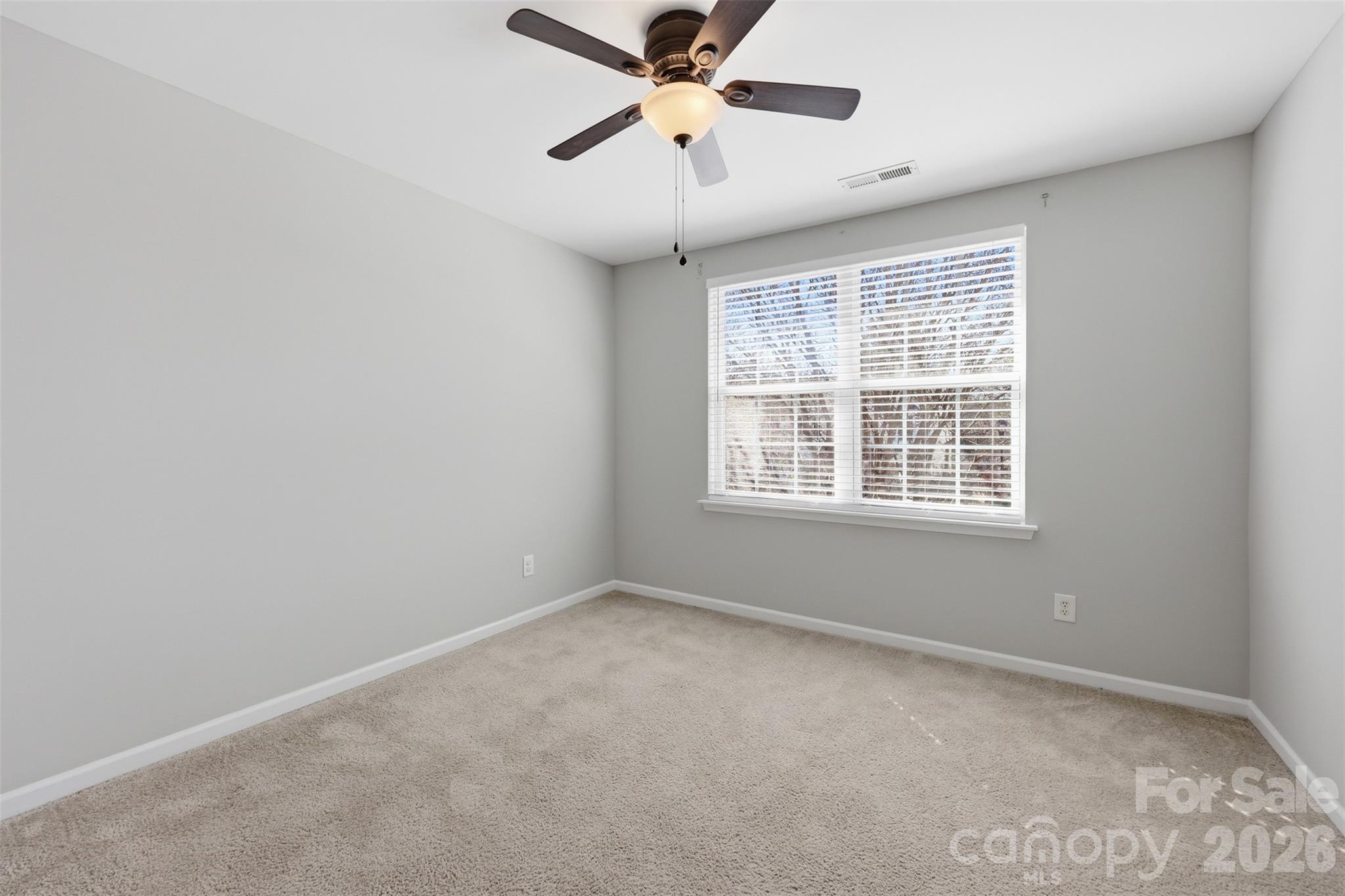 212 Primrose Walk Fort Mill, SC 29715 - Photo 21 of 37 a view of an empty room with a window