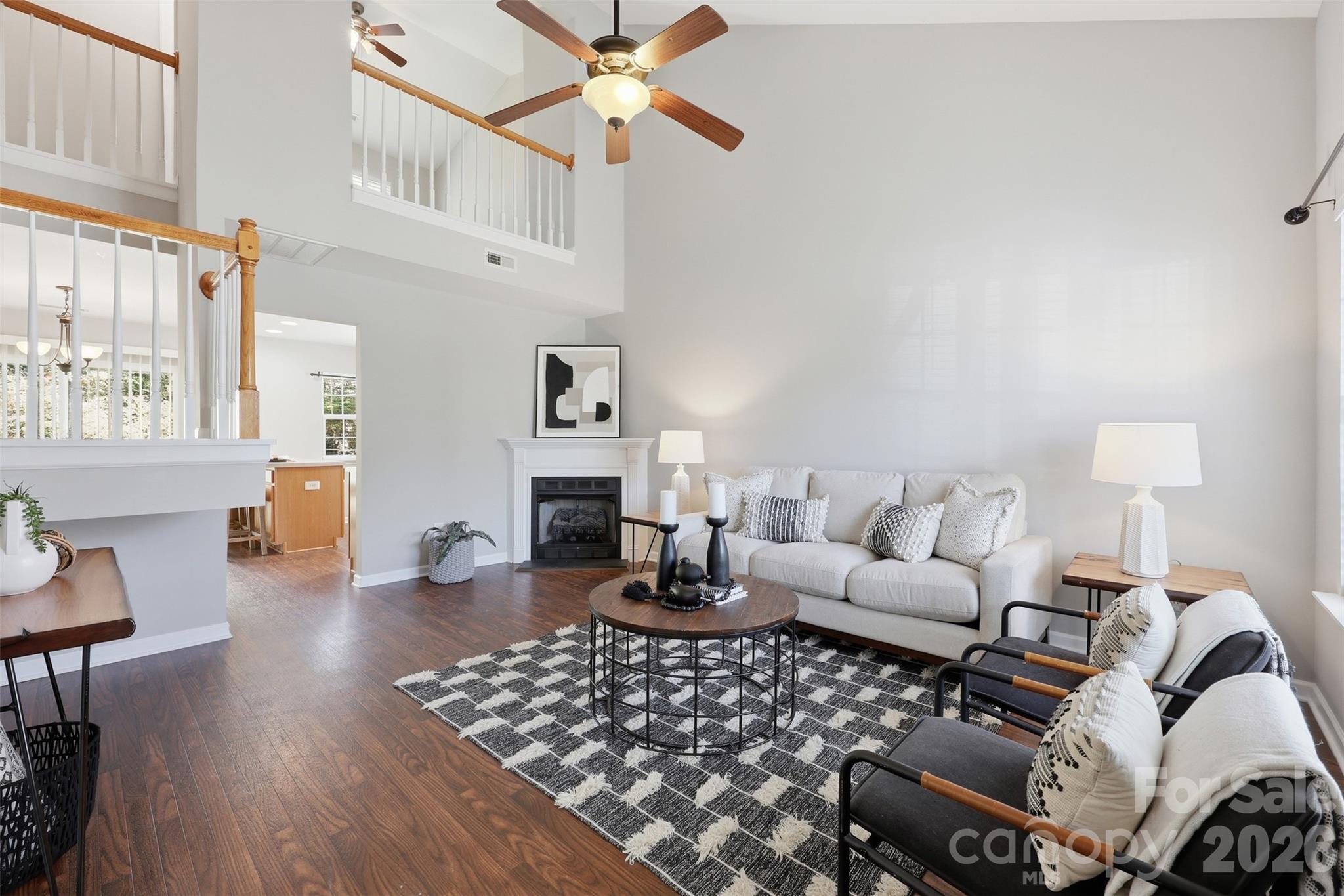 212 Primrose Walk Fort Mill, SC 29715 - Photo 4 of 37 a living room with furniture and wooden floor