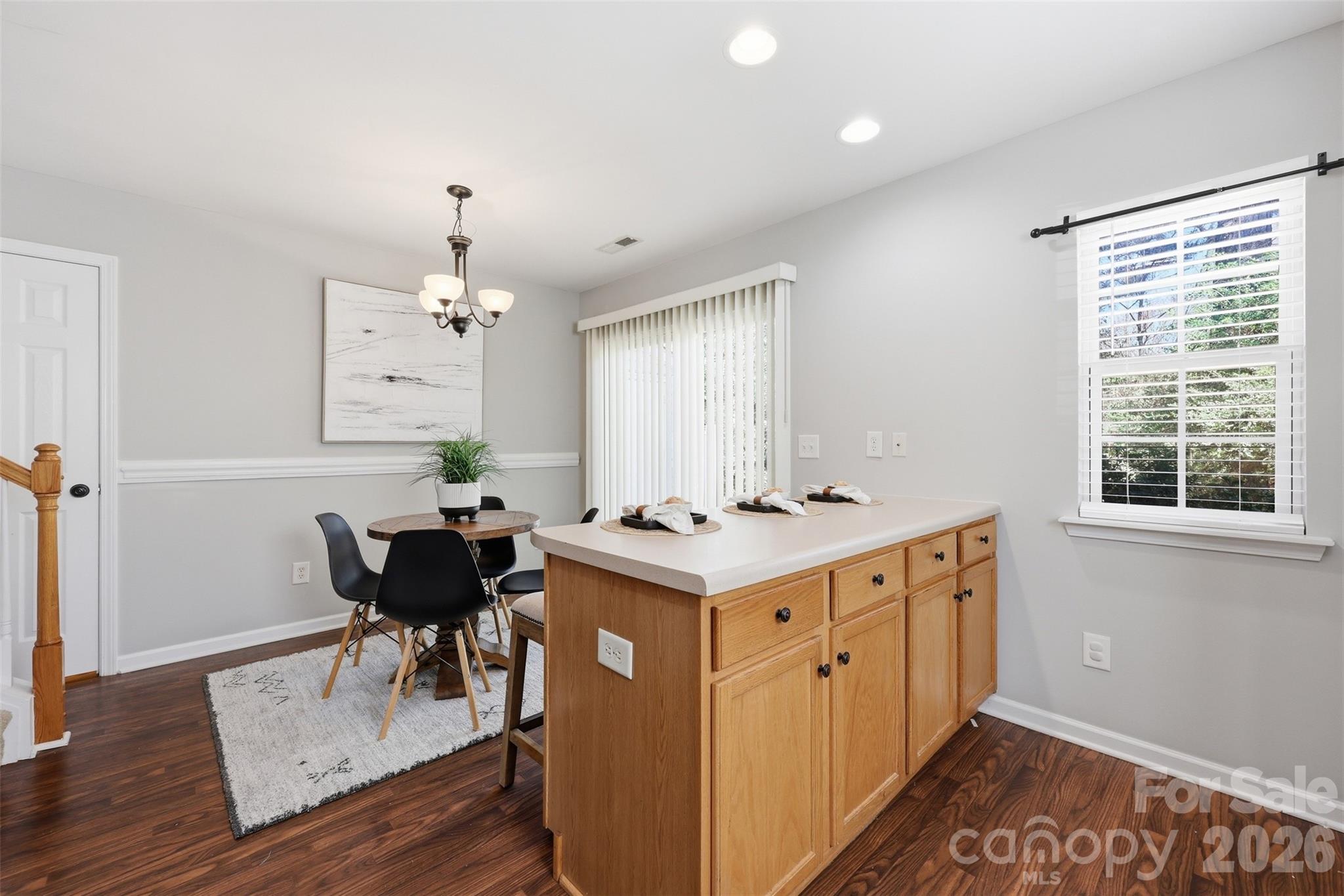 212 Primrose Walk Fort Mill, SC 29715 - Photo 5 of 37 a kitchen with a stove and a table