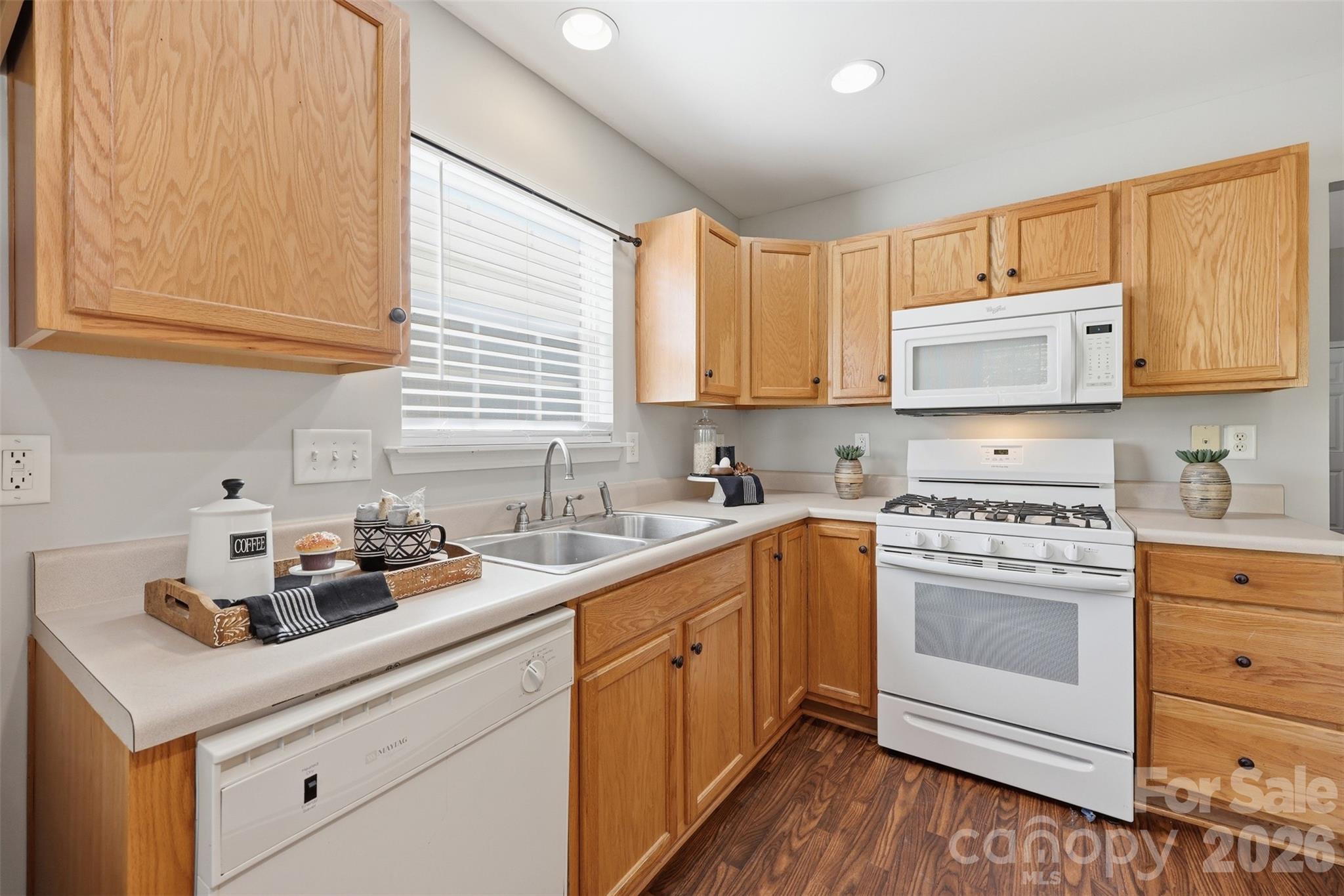 212 Primrose Walk Fort Mill, SC 29715 - Photo 6 of 37 a kitchen with cabinets appliances a sink and a window