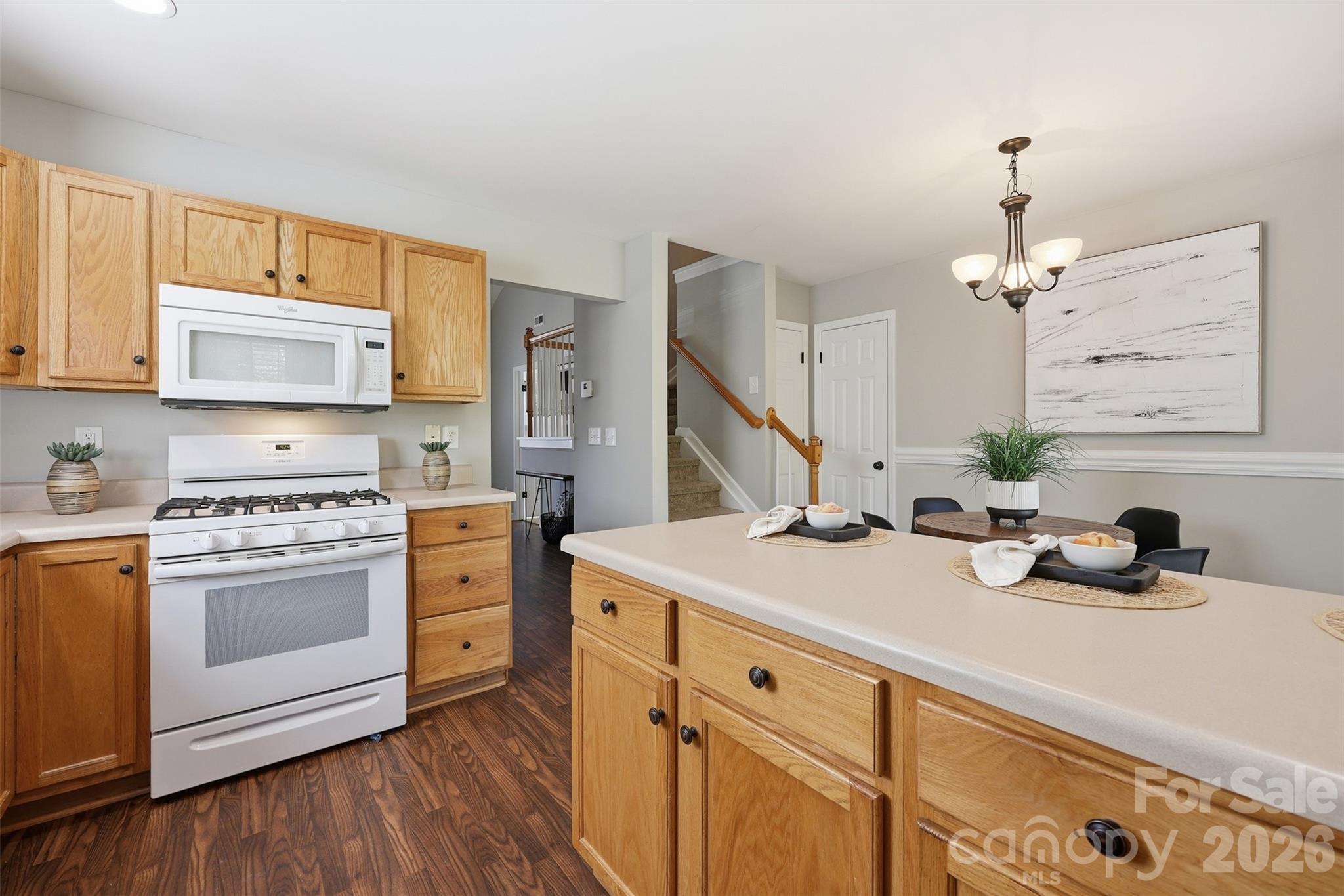 212 Primrose Walk Fort Mill, SC 29715 - Photo 10 of 37 a kitchen with cabinets a sink and appliances