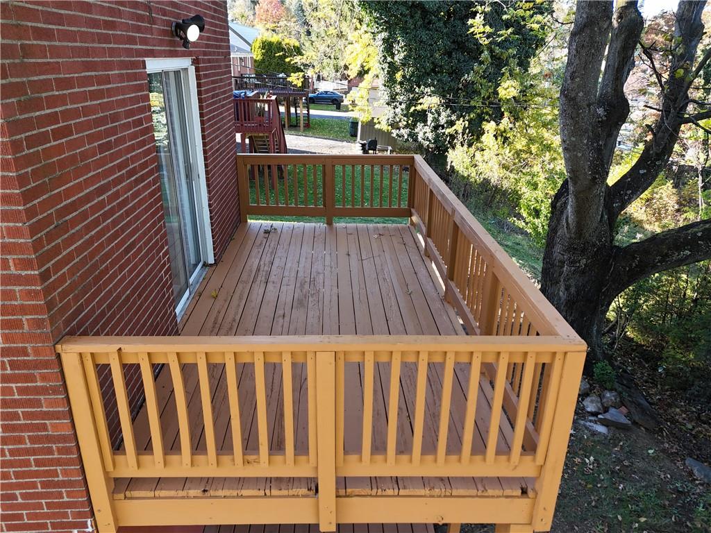 5113 Azalea Drive Pittsburgh, PA 15236 - Photo 22 of 26 a backyard of a house with wooden floor