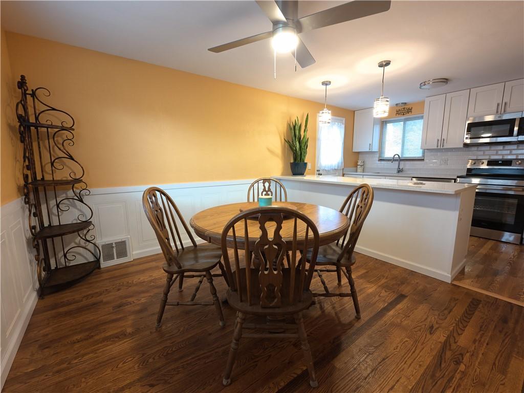 5113 Azalea Drive Pittsburgh, PA 15236 - Photo 4 of 26 a view of a dining room with furniture and wooden floor