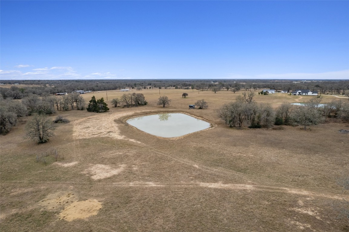 322 County Road 322 Road Rockdale, TX 76567 - Photo 5 of 20 a view of a dry yard with two large trees