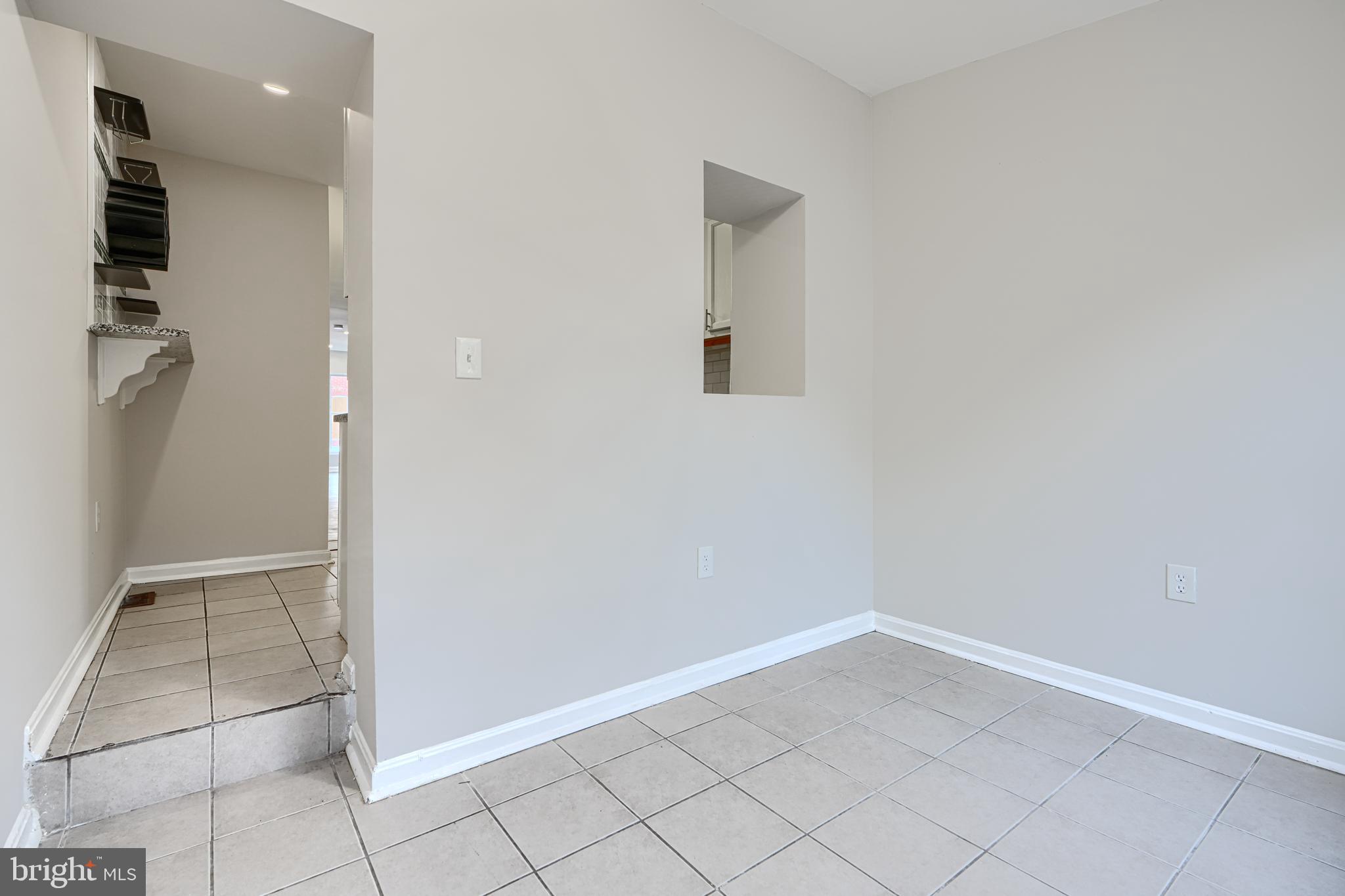 1127 Sargeant Street Baltimore, MD 21223 - Photo 14 of 30 an empty room with white door